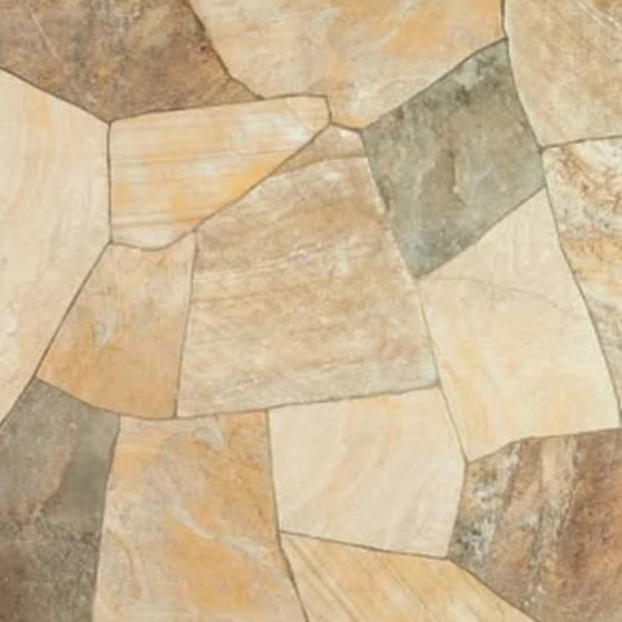 Textura aproximada de pedra São Tomé amarela, com tons creme e ferrugem.